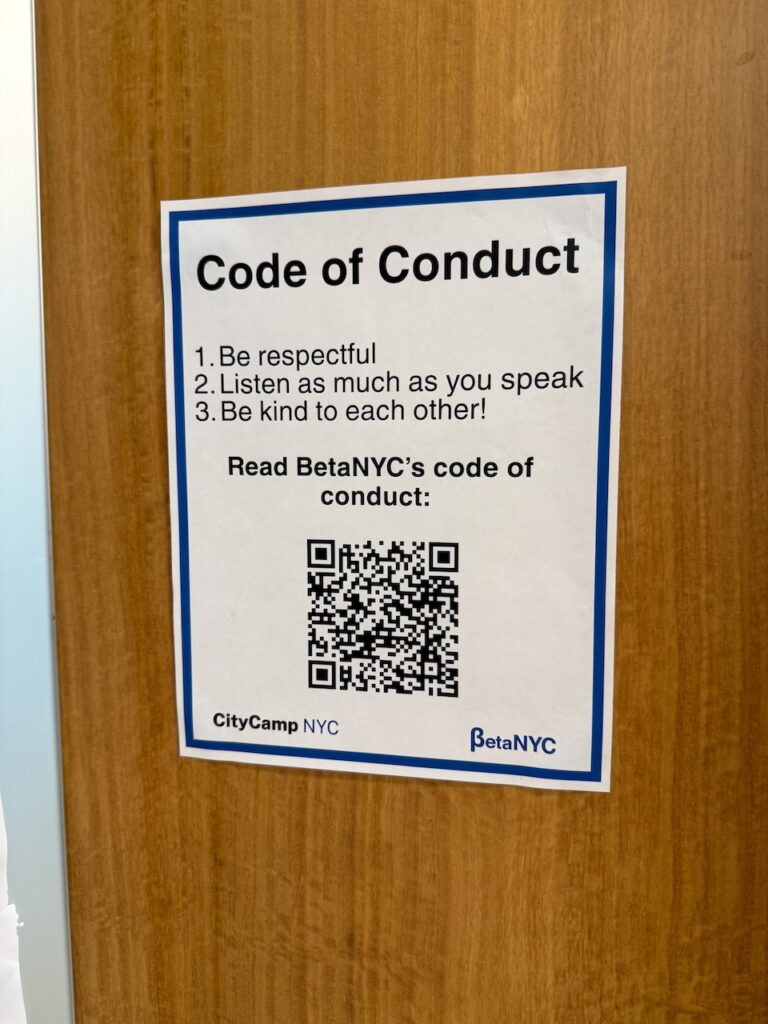 Photo of an sign that says "Code of Conduct"